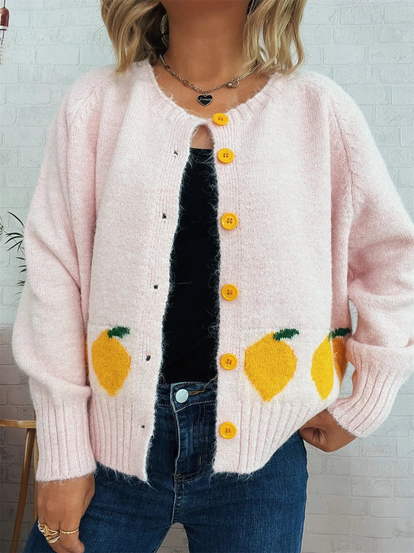 Pink button-up cardigan with playful lemon pattern – Zest & Bloom style from A Whimsical Affair.
